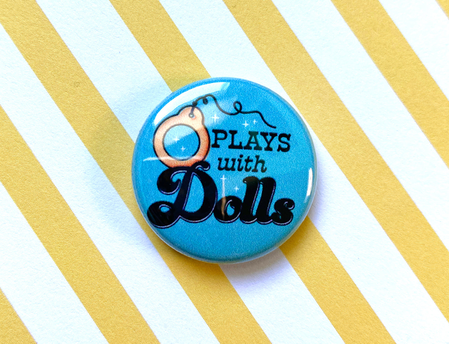 Plays With Dolls 1" Pin